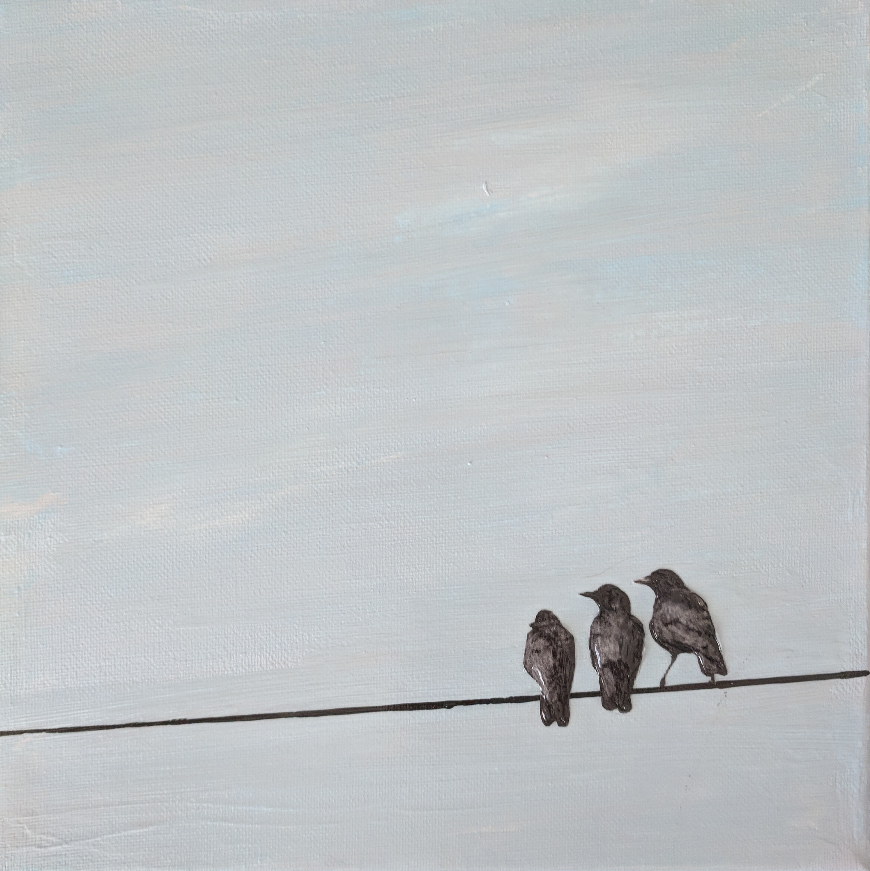 3 crows on a wire